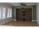 Living room with stone accent wall and ceiling fan at 3410 N 131St Ln, Litchfield Park, AZ 85340