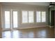 Open living area with tile floors, french doors and plantation shutters at 3410 N 131St Ln, Litchfield Park, AZ 85340