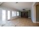 Spacious living room with a stone accent wall and tiled floors at 3410 N 131St Ln, Litchfield Park, AZ 85340