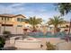 Inviting pool area with a water feature and firepit at 3410 N 131St Ln, Litchfield Park, AZ 85340