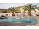 Inviting swimming pool with a waterfall feature and spacious patio at 3410 N 131St Ln, Litchfield Park, AZ 85340