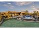 Landscaped backyard with a pool, putting green, and desert plants at 38450 N 95Th Way, Scottsdale, AZ 85262