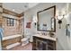 Bright bathroom with beige tile and a dark vanity at 38450 N 95Th Way, Scottsdale, AZ 85262