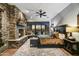 Grand Primary bedroom with stone fireplace, patio access, and large bed at 38450 N 95Th Way, Scottsdale, AZ 85262