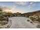Stunning curb appeal with a large driveway and desert landscaping at 38450 N 95Th Way, Scottsdale, AZ 85262
