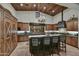 Large kitchen with an island, high ceilings and wood cabinets at 38450 N 95Th Way, Scottsdale, AZ 85262