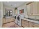 Laundry room with granite countertops and ample cabinet space at 38450 N 95Th Way, Scottsdale, AZ 85262