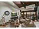 Cozy living area with comfortable seating, a large TV, and views of the backyard at 38450 N 95Th Way, Scottsdale, AZ 85262