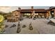 Outdoor patio with a built-in grill and seating area at 38450 N 95Th Way, Scottsdale, AZ 85262