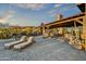 Spacious patio with lounge chairs and mountain views at 38450 N 95Th Way, Scottsdale, AZ 85262