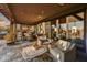 Covered patio with fireplace and comfortable furniture at 38450 N 95Th Way, Scottsdale, AZ 85262