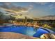 Stunning pool and spa with a putting green and desert landscape at 38450 N 95Th Way, Scottsdale, AZ 85262