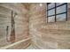 Spa-like shower with a built-in bench and a large window at 38450 N 95Th Way, Scottsdale, AZ 85262