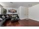 Living room featuring hardwood floors, sectional sofa, and neutral colors at 4315 N 154Th Dr, Goodyear, AZ 85395