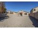 Backyard view of house and gravel area at 4320 S Rim Ct, Gilbert, AZ 85297