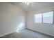 Simple bedroom with carpet and a window at 4320 S Rim Ct, Gilbert, AZ 85297