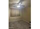 Simple bedroom with beige carpet and ceiling fan at 4331 E Amberwood Dr, Phoenix, AZ 85048