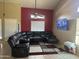 Living room with a large sectional sofa and a flat-screen TV at 4331 E Amberwood Dr, Phoenix, AZ 85048