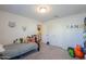 bedroom with twin bed, plenty of storage, and playful decor at 45081 W Sandhill Rd, Maricopa, AZ 85139