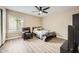 Bright bedroom with a comfy chair and a ceiling fan at 4950 N Miller Rd # 210, Scottsdale, AZ 85251