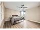 Spacious bedroom with wood-look floors and ceiling fan at 4950 N Miller Rd # 210, Scottsdale, AZ 85251