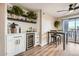 Dining area with wine cooler and built-in shelving at 4950 N Miller Rd # 210, Scottsdale, AZ 85251