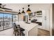 Modern kitchen with island and balcony view at 4950 N Miller Rd # 210, Scottsdale, AZ 85251