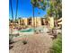 Community pool with surrounding patio at 4950 N Miller Rd # 210, Scottsdale, AZ 85251