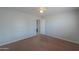 Bright bedroom featuring neutral walls and carpet at 50011 W Mayer Blvd, Maricopa, AZ 85139