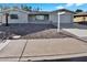 Single story home with a spacious driveway and mature landscaping at 5113 E Florian Ave, Mesa, AZ 85206