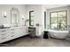 Spa-like bathroom with soaking tub, walk-in shower, and double vanity at 5939 E Quartz Mountain Rd, Paradise Valley, AZ 85253