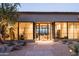 Stunning home exterior with large windows and desert landscaping at 5939 E Quartz Mountain Rd, Paradise Valley, AZ 85253