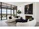 Modern living room features a large artwork and city views at 5939 E Quartz Mountain Rd, Paradise Valley, AZ 85253