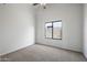 Well-lit bedroom with ceiling fan and carpet flooring at 6623 E Oasis St, Mesa, AZ 85215