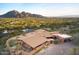 Aerial view showcasing a large home and mountain backdrop at 7150 N Hillside Dr, Paradise Valley, AZ 85253