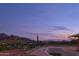 Empty pool with mountain and city views at sunset at 7150 N Hillside Dr, Paradise Valley, AZ 85253