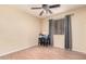 Simple bedroom with ceiling fan and two stools at 74 S 94Th Pl, Chandler, AZ 85224