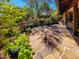 Flagstone patio with lush landscaping and seating area at 7830 E Carefree Estates Cir, Carefree, AZ 85377