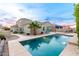 Inviting backyard oasis with a sparkling pool, spacious patio, and lush landscaping at 808 W Brangus Way, San Tan Valley, AZ 85143