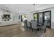 Elegant dining room with a large table and gray upholstered chairs at 8500 E Aster Dr, Scottsdale, AZ 85260