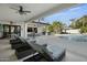 Inviting pool area with lounge chairs and an outdoor dining space at 8500 E Aster Dr, Scottsdale, AZ 85260