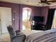 Bright bedroom with ensuite bathroom and TV at 8809 W Windrose Dr, Peoria, AZ 85381