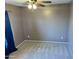 Spacious bedroom with neutral walls and ceiling fan at 8809 W Windrose Dr, Peoria, AZ 85381