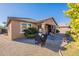 Landscaped backyard with patio and grill at 16140 W Almeria Rd, Goodyear, AZ 85395