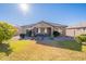 Charming home with grassy backyard, patio, and grill at 16140 W Almeria Rd, Goodyear, AZ 85395