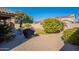 Large backyard with patio, grill and mature plants at 16140 W Almeria Rd, Goodyear, AZ 85395