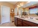 Double vanity bathroom with a large mirror and plenty of counter space at 16140 W Almeria Rd, Goodyear, AZ 85395