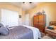 Bright bedroom with double closet and comfortable bed at 16140 W Almeria Rd, Goodyear, AZ 85395