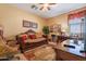 Elegant bedroom with a comfortable bed and a built-in wooden wardrobe at 16140 W Almeria Rd, Goodyear, AZ 85395