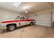 Attached garage with ample space for a vehicle at 16140 W Almeria Rd, Goodyear, AZ 85395